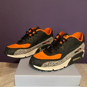 Orange and black and white leopard print NIKE Air Max 90 women sneakers.